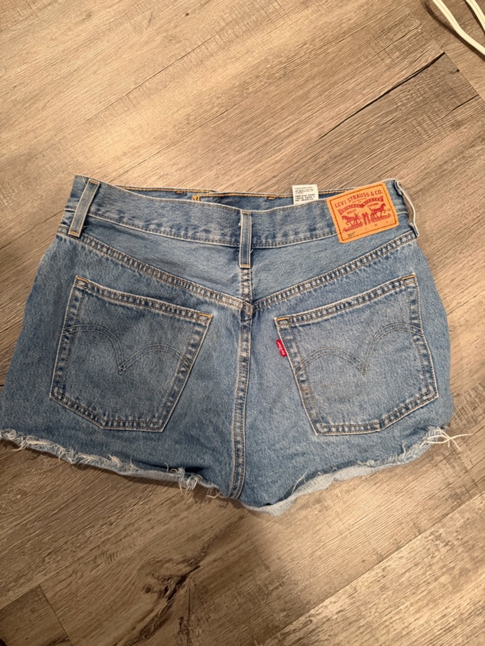 Levi's Light Blue Distressed Denim Cutoff Shorts - Picture 2 of 4
